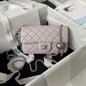 CHANEL MINI FLAP BAG SHINY CALFSKIN & SILVER-TONE METAL LIGHT PINK 4.7 × 7.8 × 2.3 in